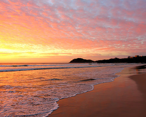 a sunset over a body of water