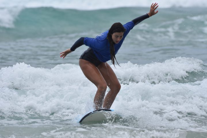 a person riding a wave on a surfboard in the ocean