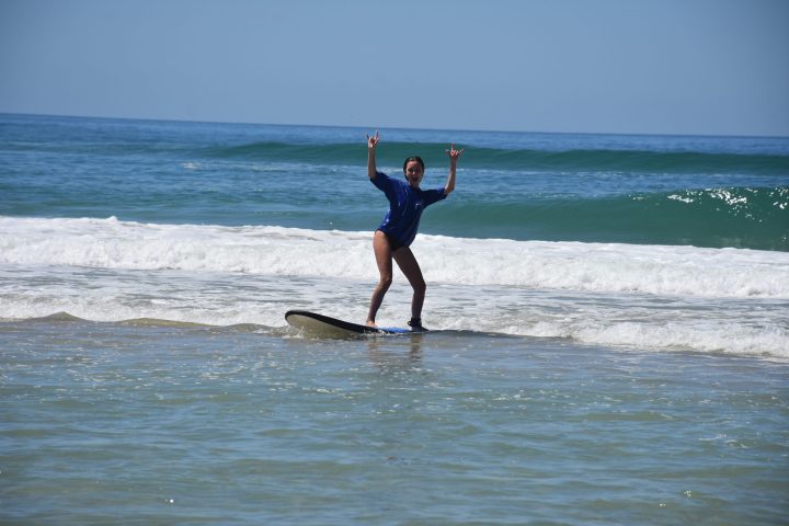 a man riding a wave on a surfboard in the water