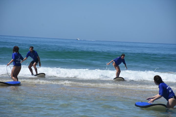 a man riding a wave on a surfboard in the ocean