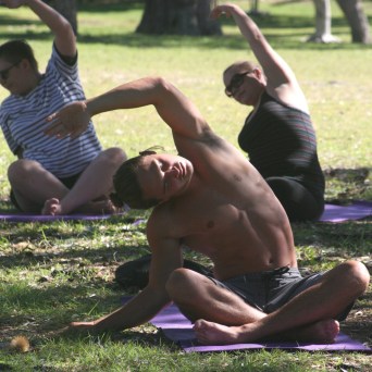 a group of people sitting at a park