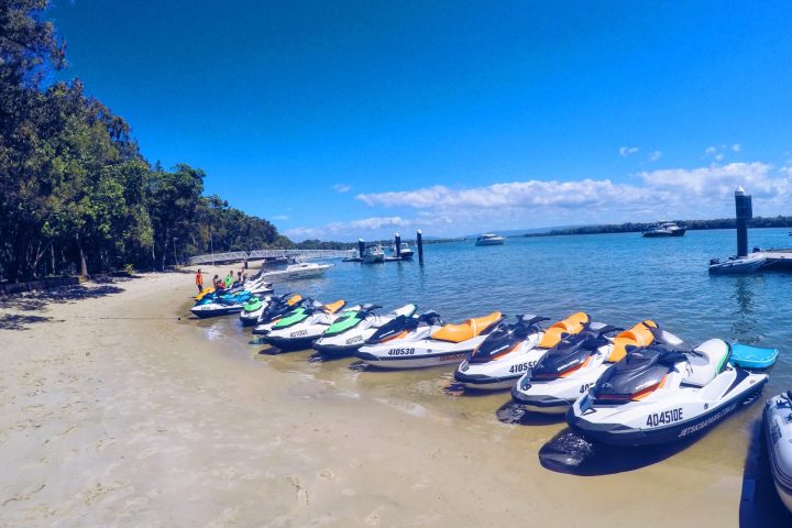 a boat sitting on top of a sandy beach