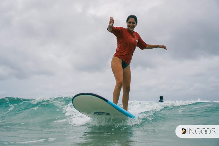 a person riding a wave on a surfboard in the ocean