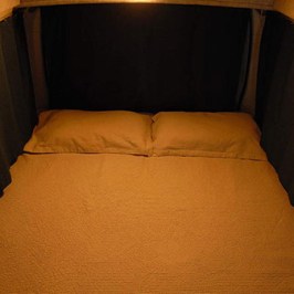 a lamp that is sitting on a bed