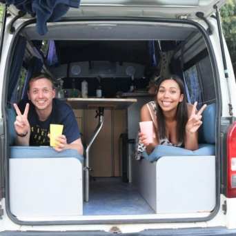 a person in a car posing for the camera