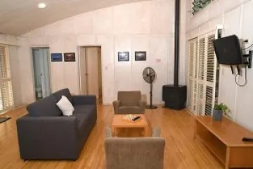 a living room filled with furniture and a large window