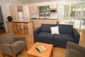 a living room filled with furniture and a fire place