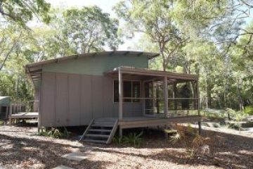 a house with trees in the background