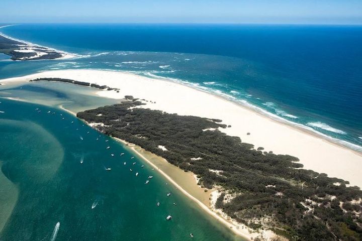 a view of a beach next to the ocean